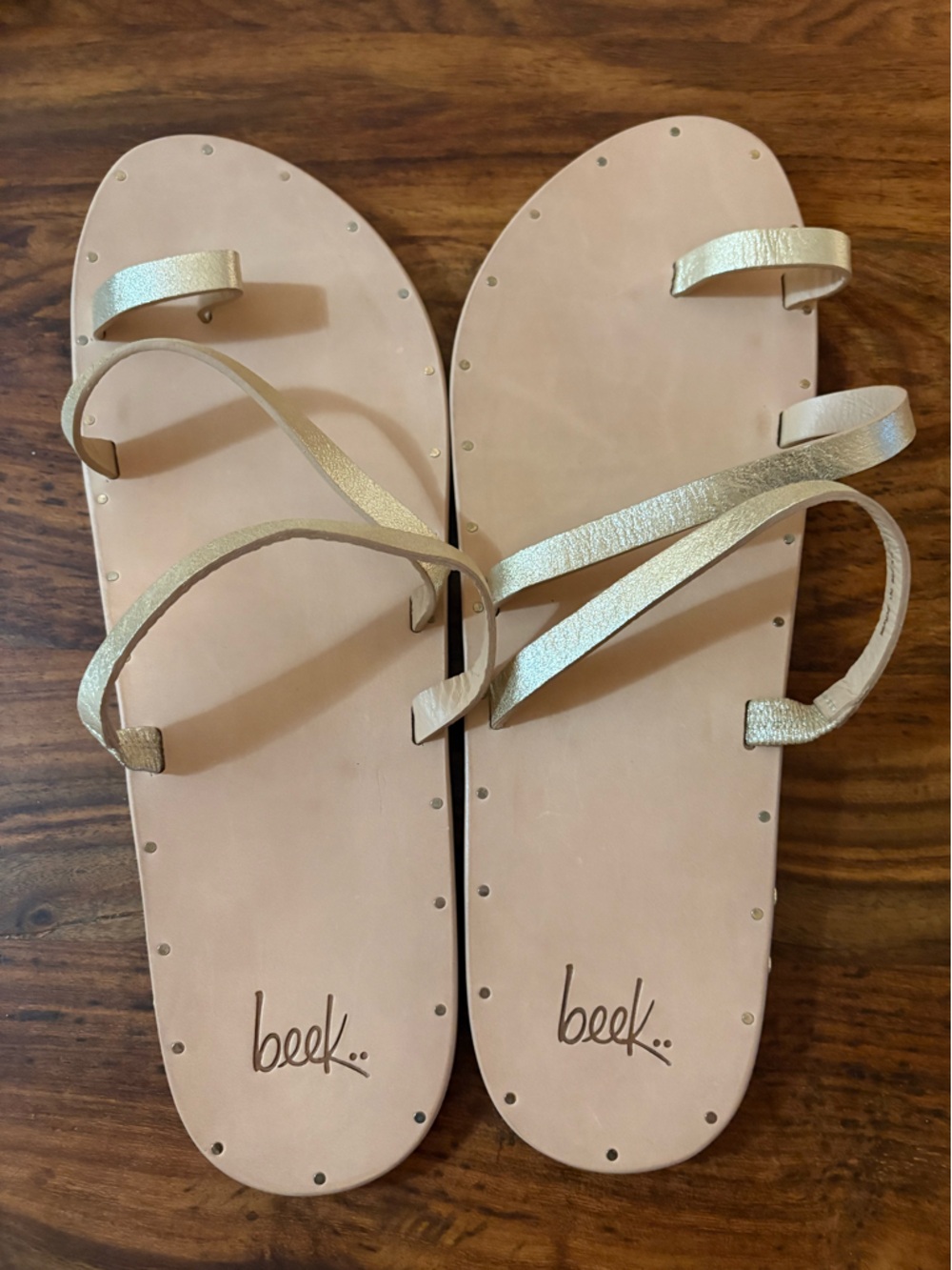beek Metallic Gold Strappy Flat Sandals on Nude Footbed